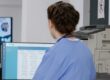Care manager checking audit-ready staff training records before an inspection