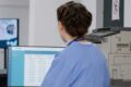 Care manager checking audit-ready staff training records before an inspection