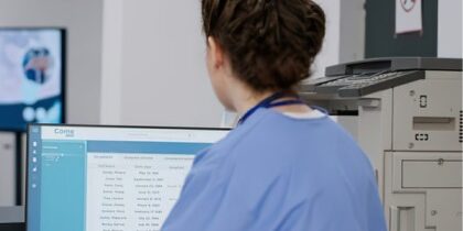 Care manager checking audit-ready staff training records before an inspection